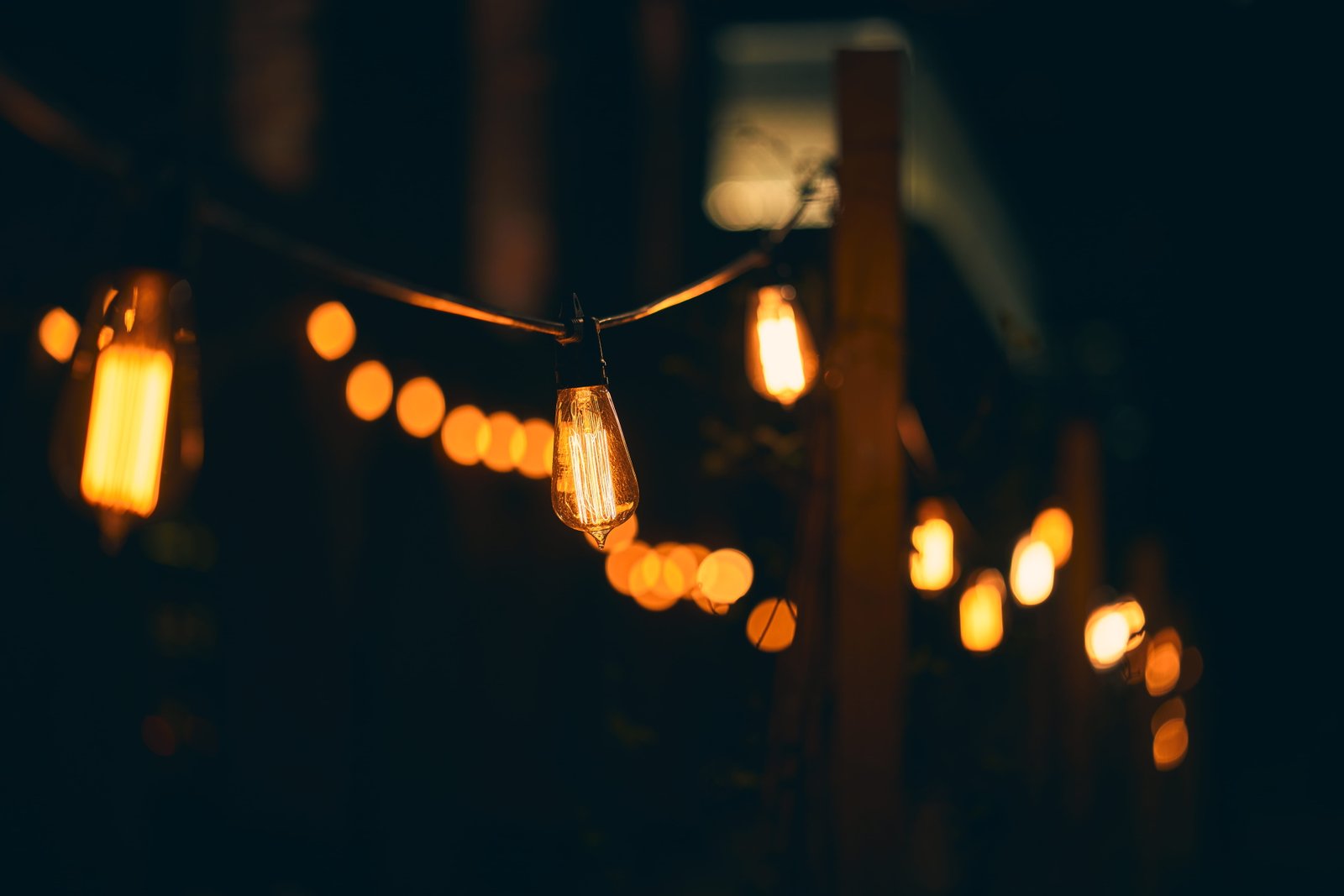 bulb string lights lamp filament yellow warm bokeh darkness 2k 4k 5k 8k