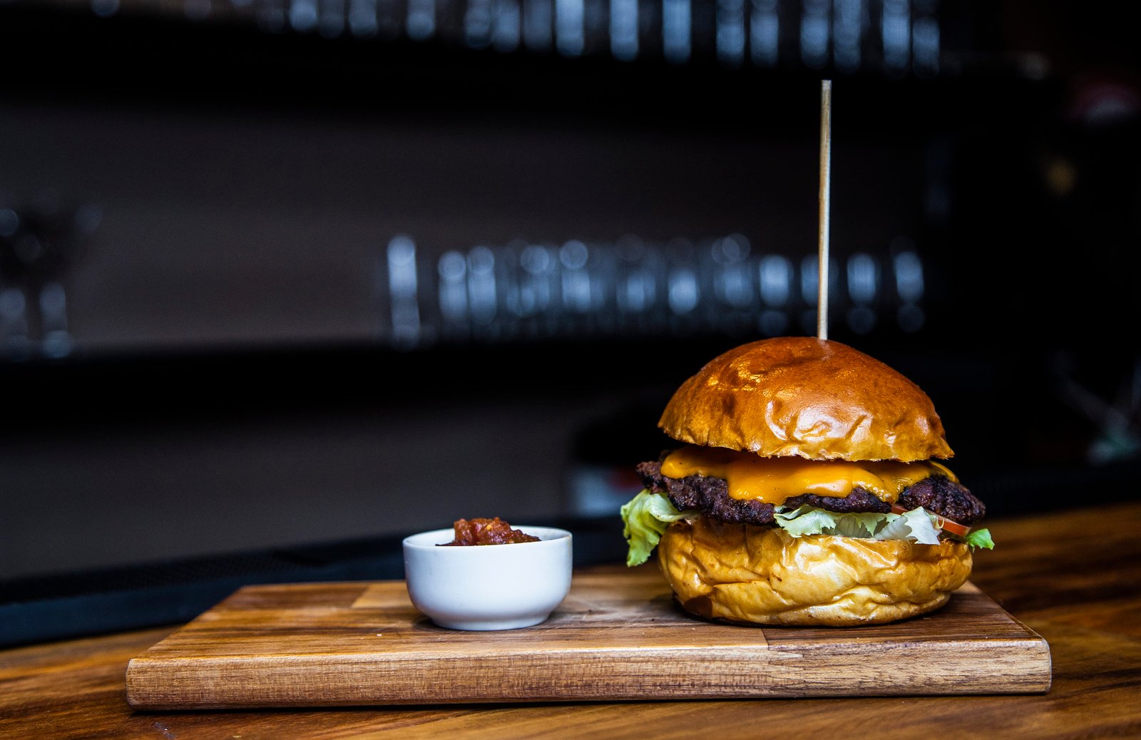 burger with meat and lettuce food bokeh blur wooden table 2k 4k 5k