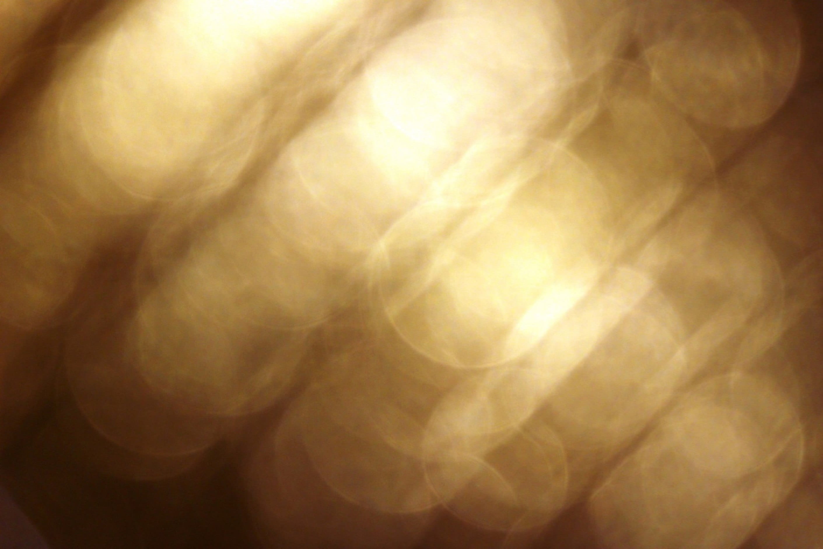 Gold light bokeh effect in diagonal pattern golden line background 2k