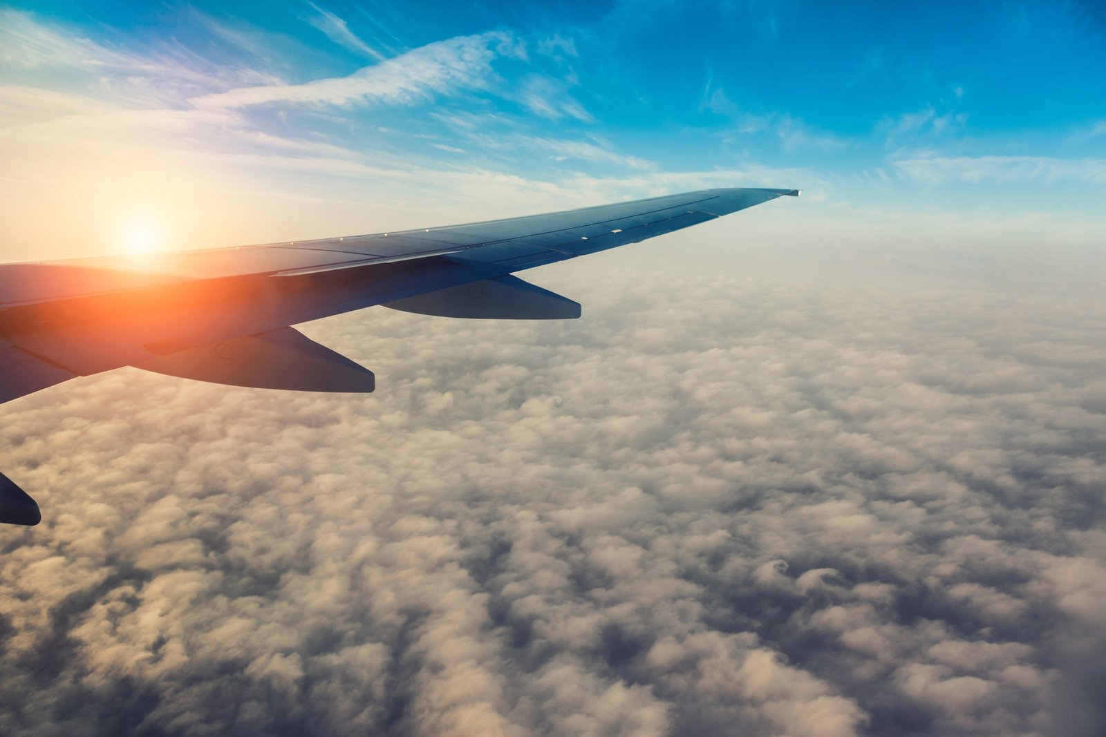gray airplane wing the sky sun clouds flight plane 2k 4k 5k