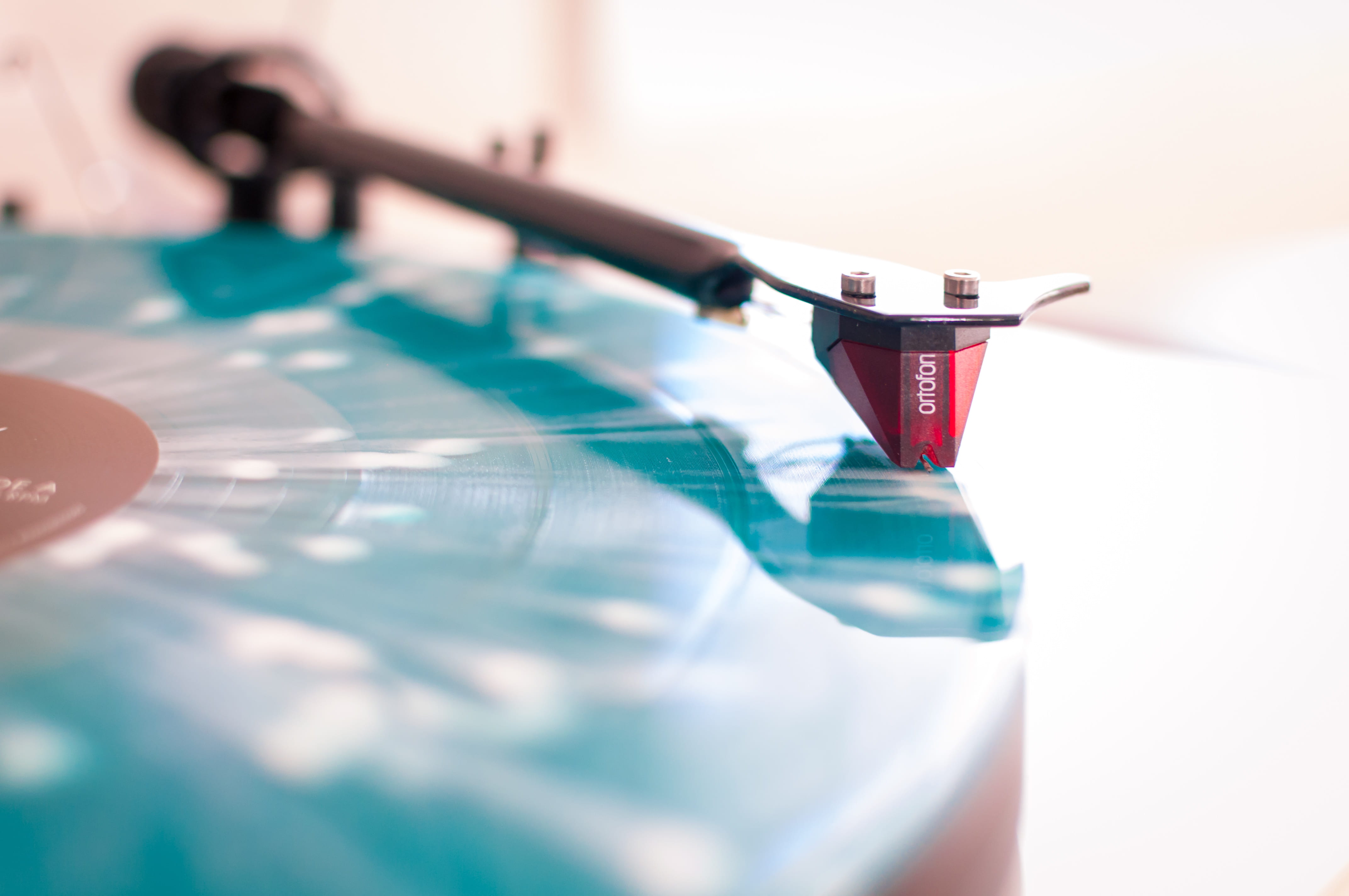 selective focus photo of blue and black turntable close up red frame 2k 4k