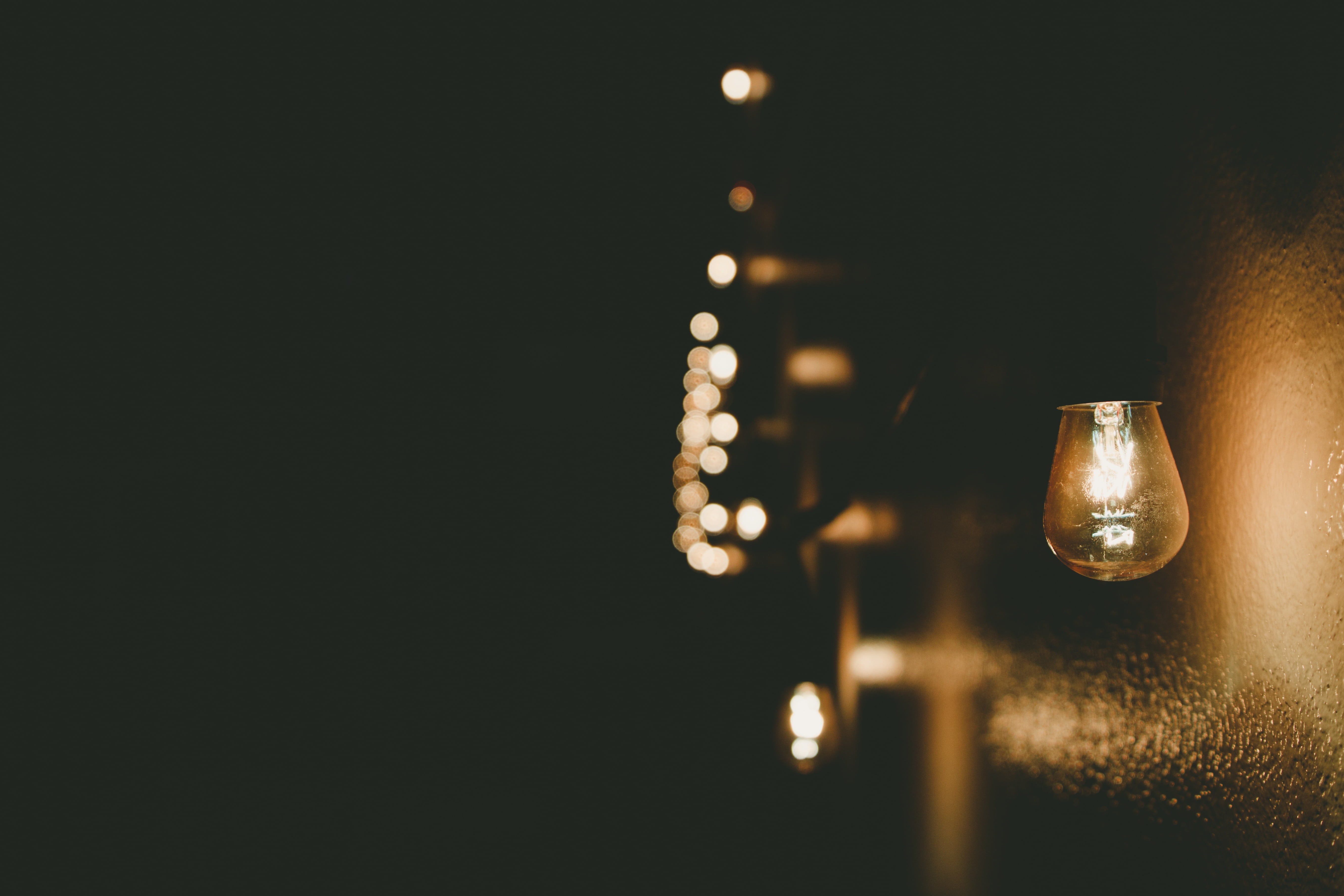 shallow focus photography of light bulb tilt shift lens dark 2k 4k 5k