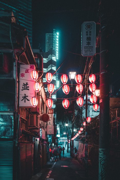 lighted lantern at night street building alley road dark 2k