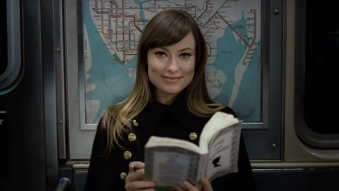 olivia wilde holding a book actress hollywood