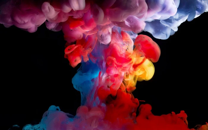 assorted color smoke paint in water black background colorful