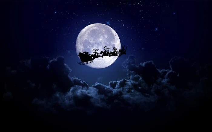 Santa Claus riding sleigh with reindeer wallpaper Christmas
