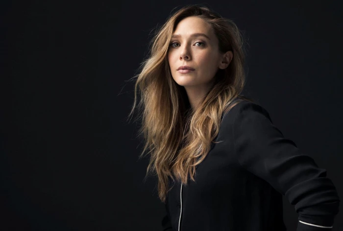 Actresses Elizabeth Olsen long hair studio shot black background