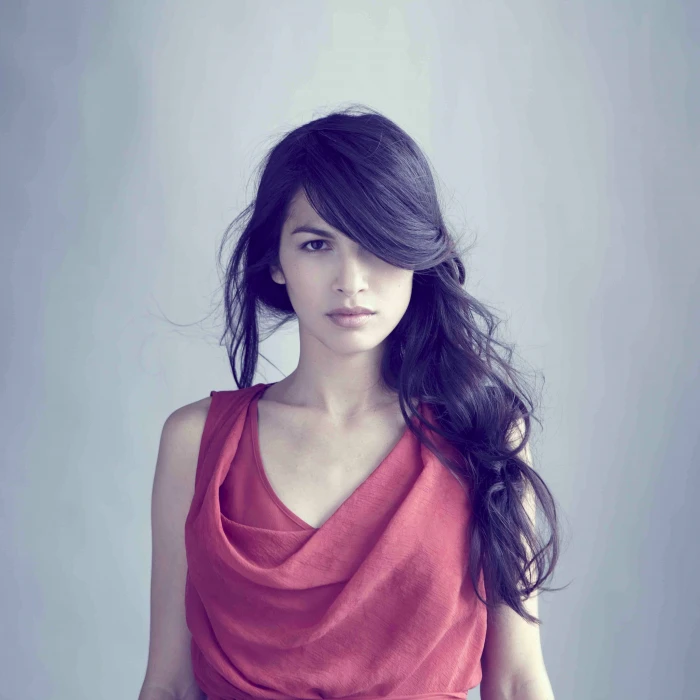 women actress brunette looking at viewer Elodie Yung simple background 2k 4k