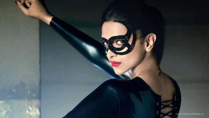 woman in black leather suit and masquerade Deepika Padukone