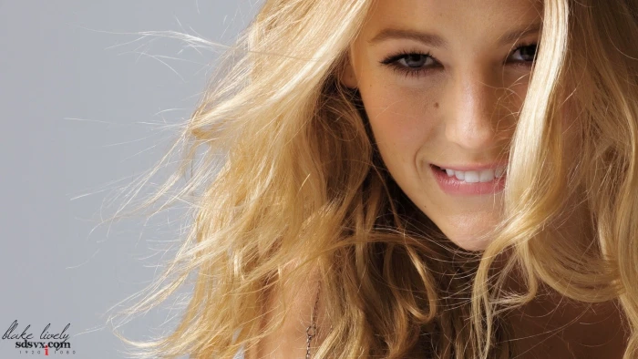 woman's face Blake Lively blonde curly hair biting lip women