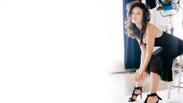 women's black halterneck dress Olivia Wilde high heels actress