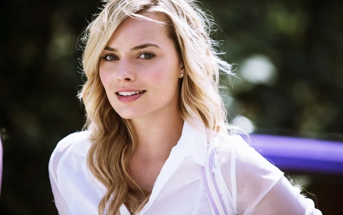 women's white button up top blonde Margot Robbie actress smiling