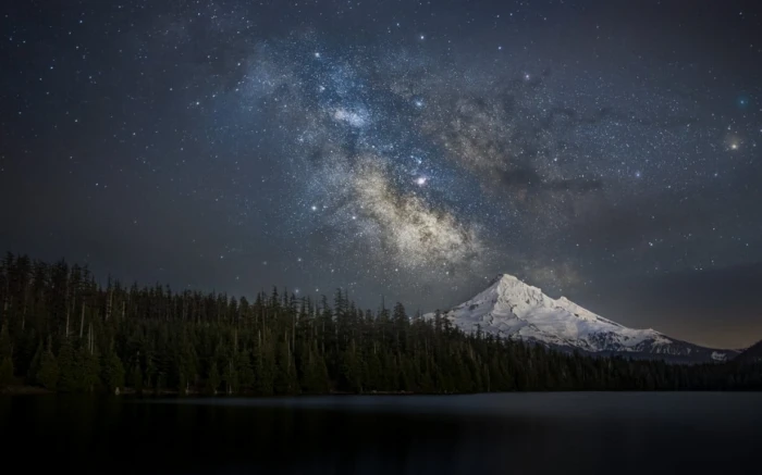 landscape photography of body water and mountain nature snowy peak