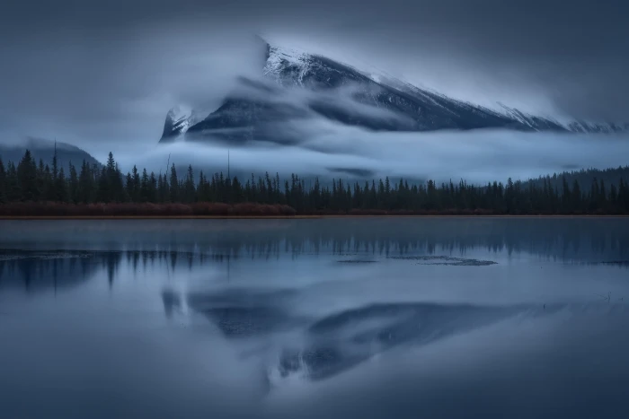 glassy water and pine trees nature landscape mountains clouds 2k