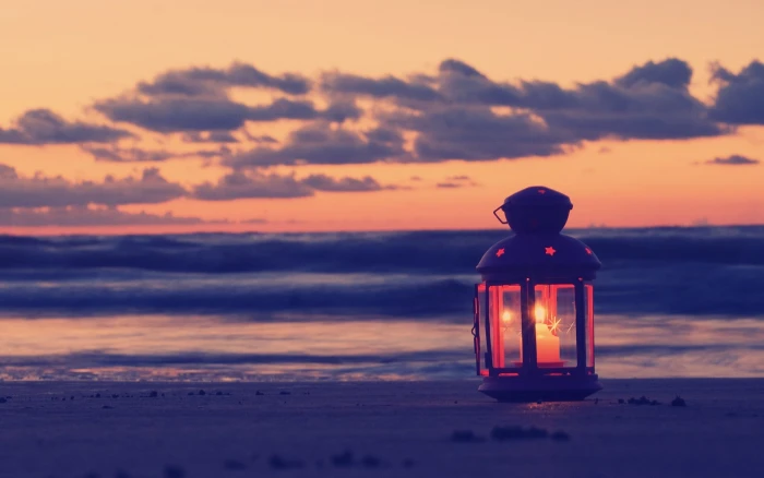 black candle sconce filter beach lantern sand clouds sunset 2k