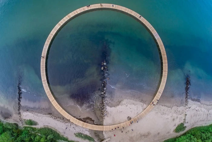 black ring nature landscape aerial view water sea stones