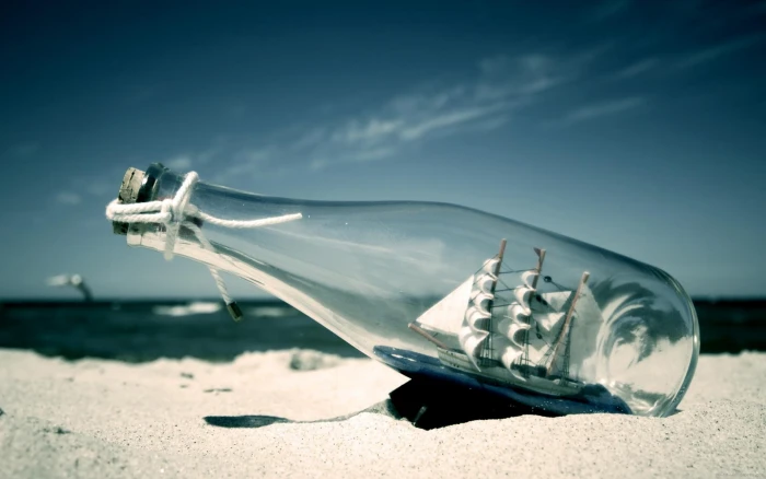 Ship in a bottle on the beach ship sand yatch 2k