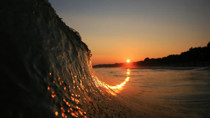 ocean wave waves sunset beach depth of field sky water 2k