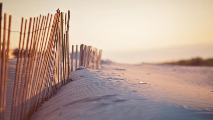 beach sand fence land sunset sky sea nature selective focus 2k