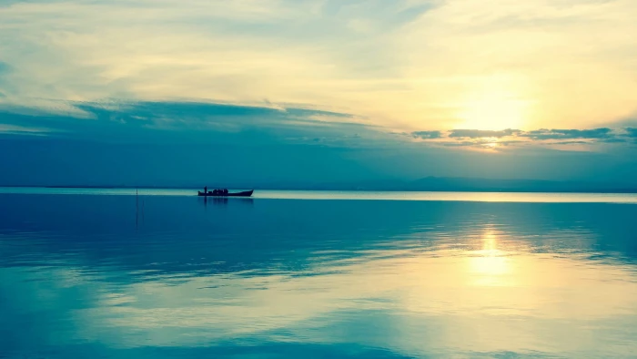 brown boat beach water sky sunlight nature beauty in 2k