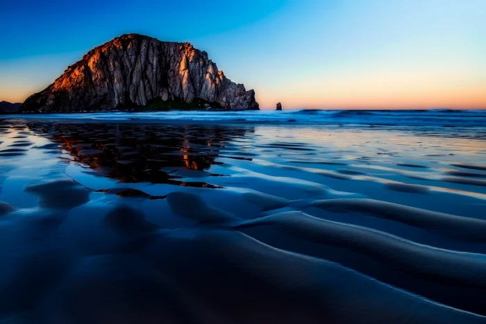brown island near bodies of water photograph morro bay california 2k