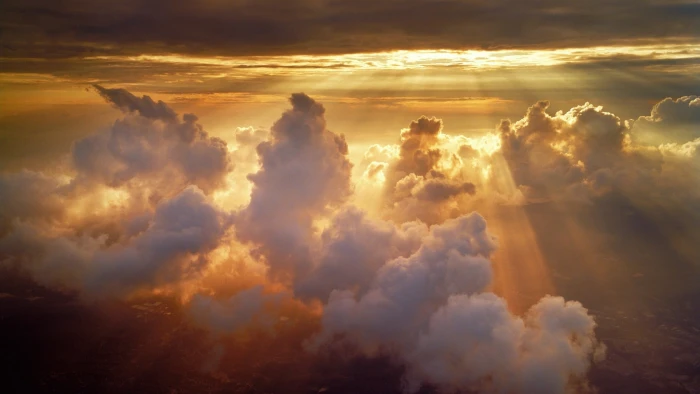 clouds under sunset nature sun rays sunlight aerial view 2k
