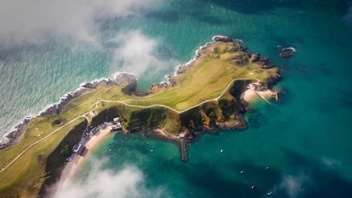 aerial view photography of mountain cliff sea coast nature 2k