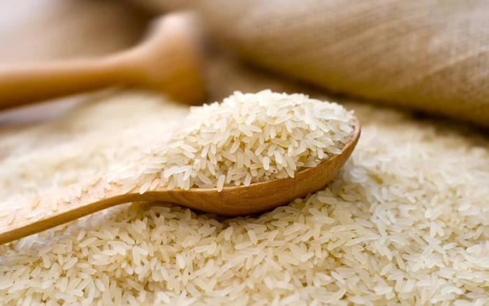 Rice In A Wooden Spoon rice grains Nature Food kitchen utensil 2k