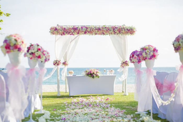 white pink and yellow floral wedding arch during daytime Flower 2k