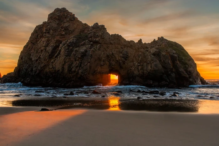 brown rock formation nature landscape sunset beach sea sand 2k