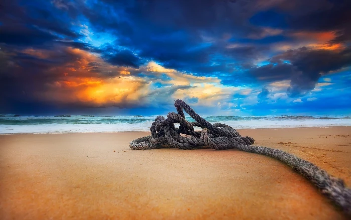 brown rope on sand at blue sky nature clouds beach sea 2k