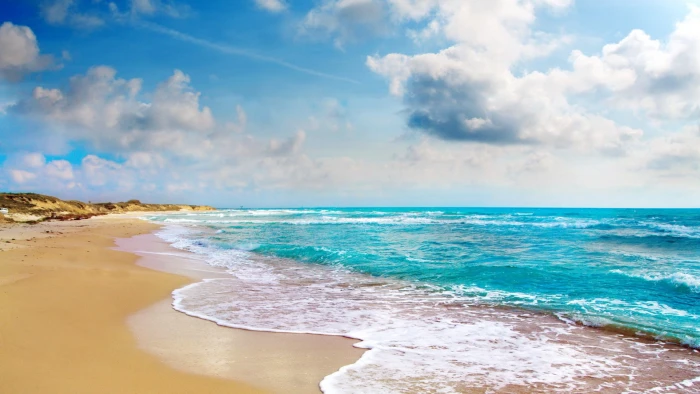 brown sand beach sky sea clouds water land cloud 2k