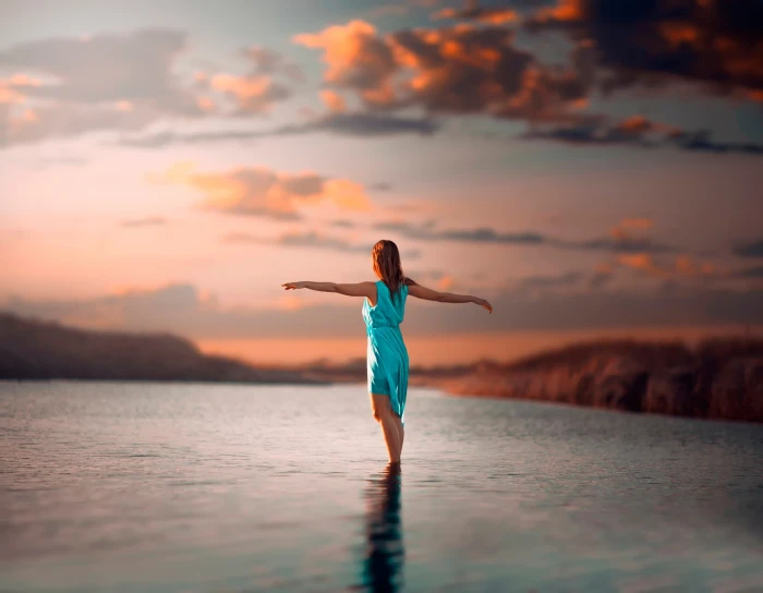 women on beach blue dress redhead in water wet clothing 2k