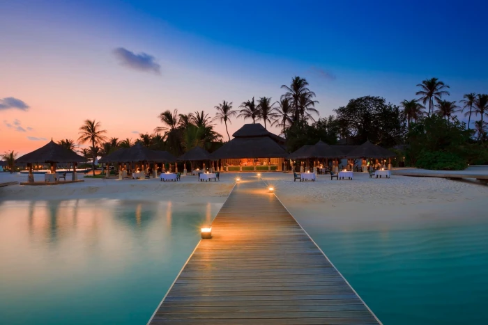 hotel sea beach pier sunset water tree sky plant beauty in nature 2k