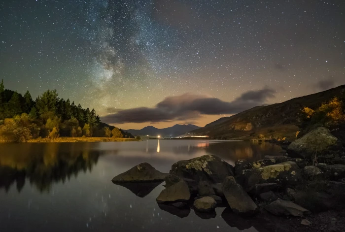 river during sunset with stars in the sky snowdonia 2k