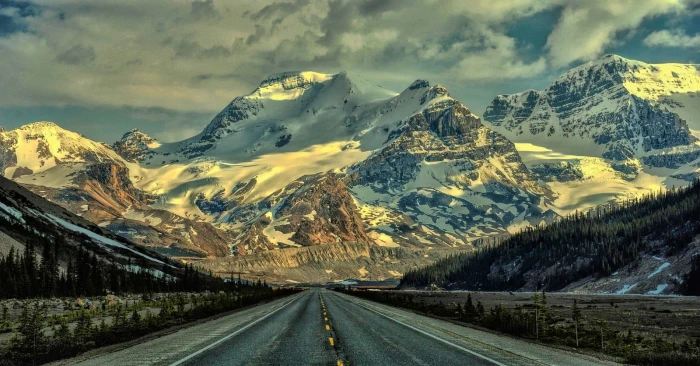 road near snow covered mountain nature landscape mountains 2k