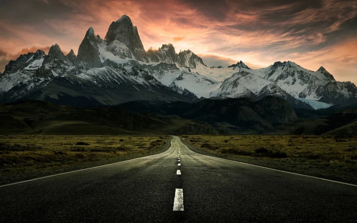 road towards mountains covered with snow digital wallpaper nature 2k
