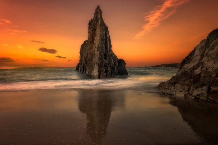 rock formation on seashore during golden hour II lines dramatic 2k