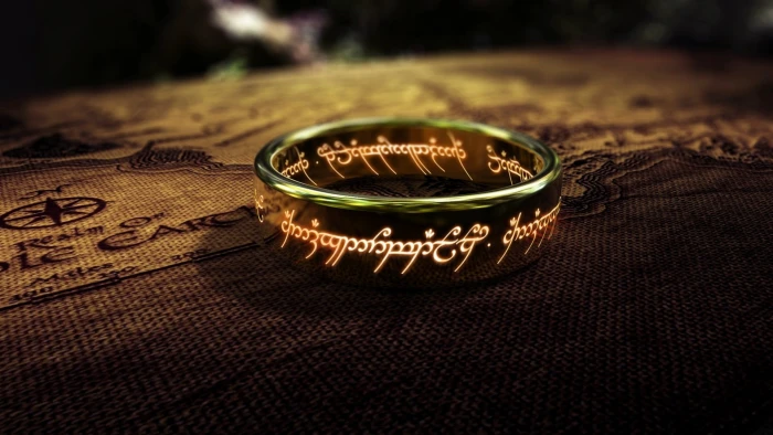 silver colored ring gold with white text The One Ring 2k