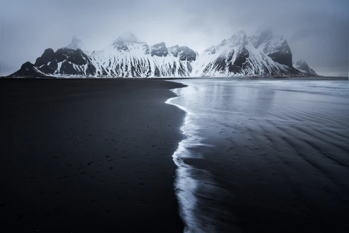 snow mountain range landscape mountains sea monochrome black sand 2k
