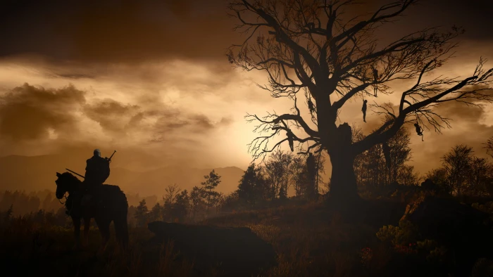 warrior horseback standing beside tree wallpaper The Witcher 2k