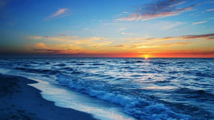 Waves of the beach at sunset waves crashing on during dusk illustration 2k