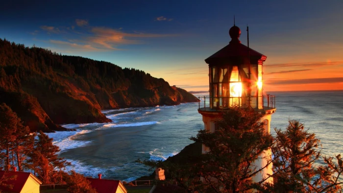 lighthouse near ocean during golden hour sunset cliff landscape