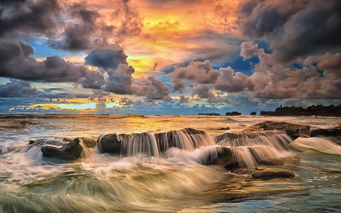nature landscape sunset coast beach sky clouds sea rock