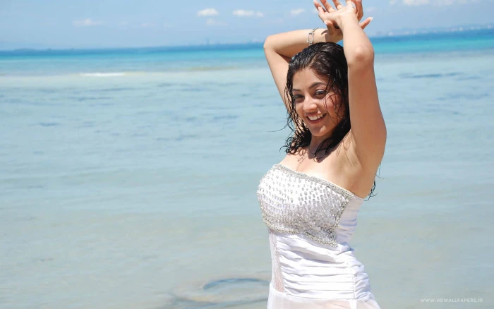 Actress Kajal Aggarwal sea beach standing leisure activity 2k