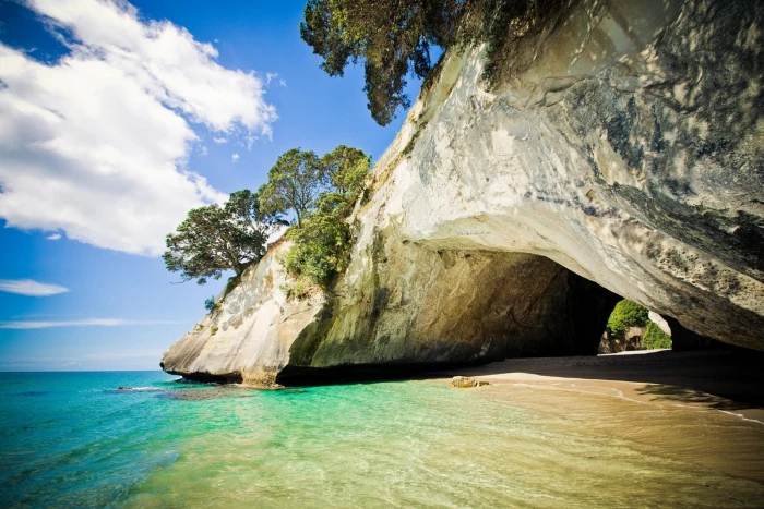 body of water nature landscape photography cave rock trees 2k