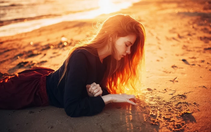 Long hair girl lying on beach sunshine dusk 2k