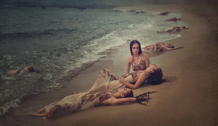 woman wearing red and white floral sleeveless dress beach sand 2k