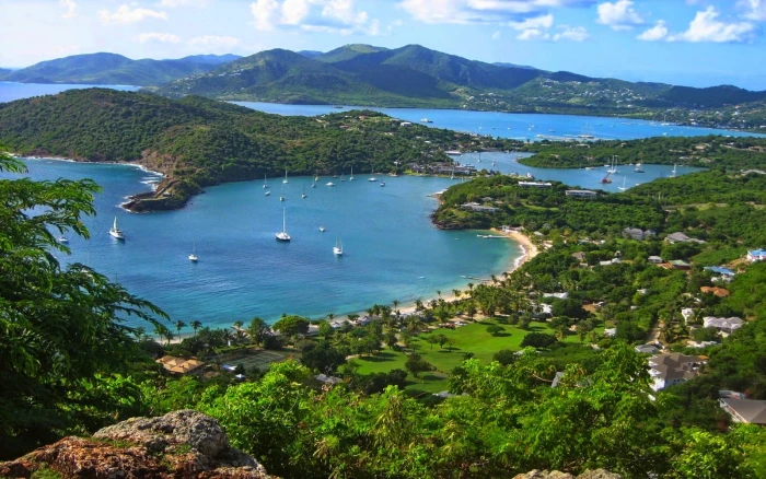 body of water near mountains nature landscape island bay 2k