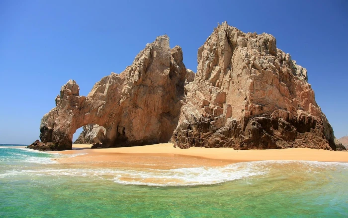nature landscape beach sea sand rock arch blue sky 2k